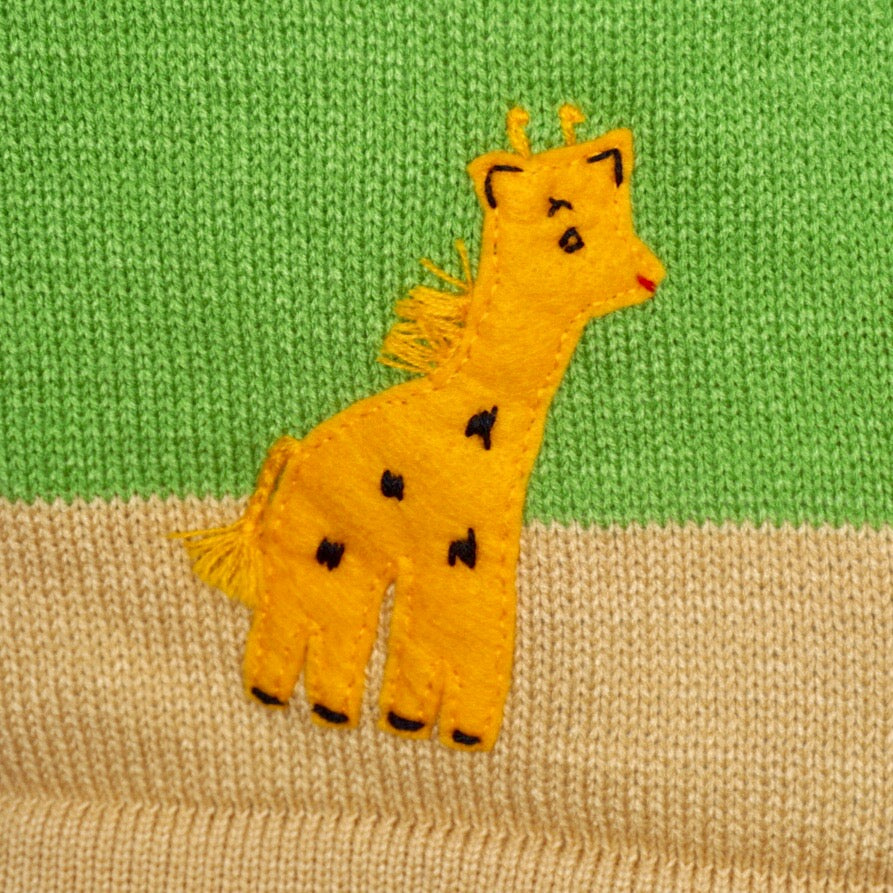 Jungle animal dress, in cream with animals embroidered along the bottom.