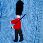 Boy's London jumper with a zip and hood, guardsman and phone box on.