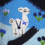 A Traditional Peruvian design - boy's country jumper in navy blue with animals on.