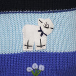 A Traditional Peruvian design - boy's country jumper in navy blue with animals on.