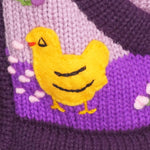 A Traditional Peruvian design - girl's country cardigan in purple with animals on.