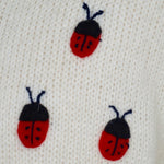 Girl's Cardigan off-white with clover and ladybirds embroidered all over.