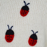 Girl's Cardigan off-white with clover and ladybirds embroidered all over.