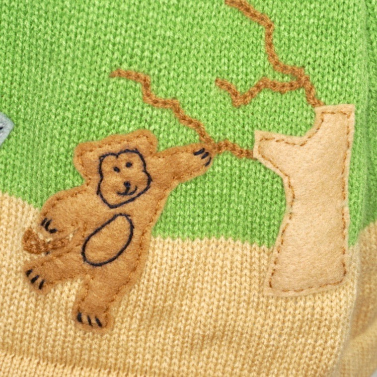 Jungle animal dress, in cream with animals embroidered along the bottom.